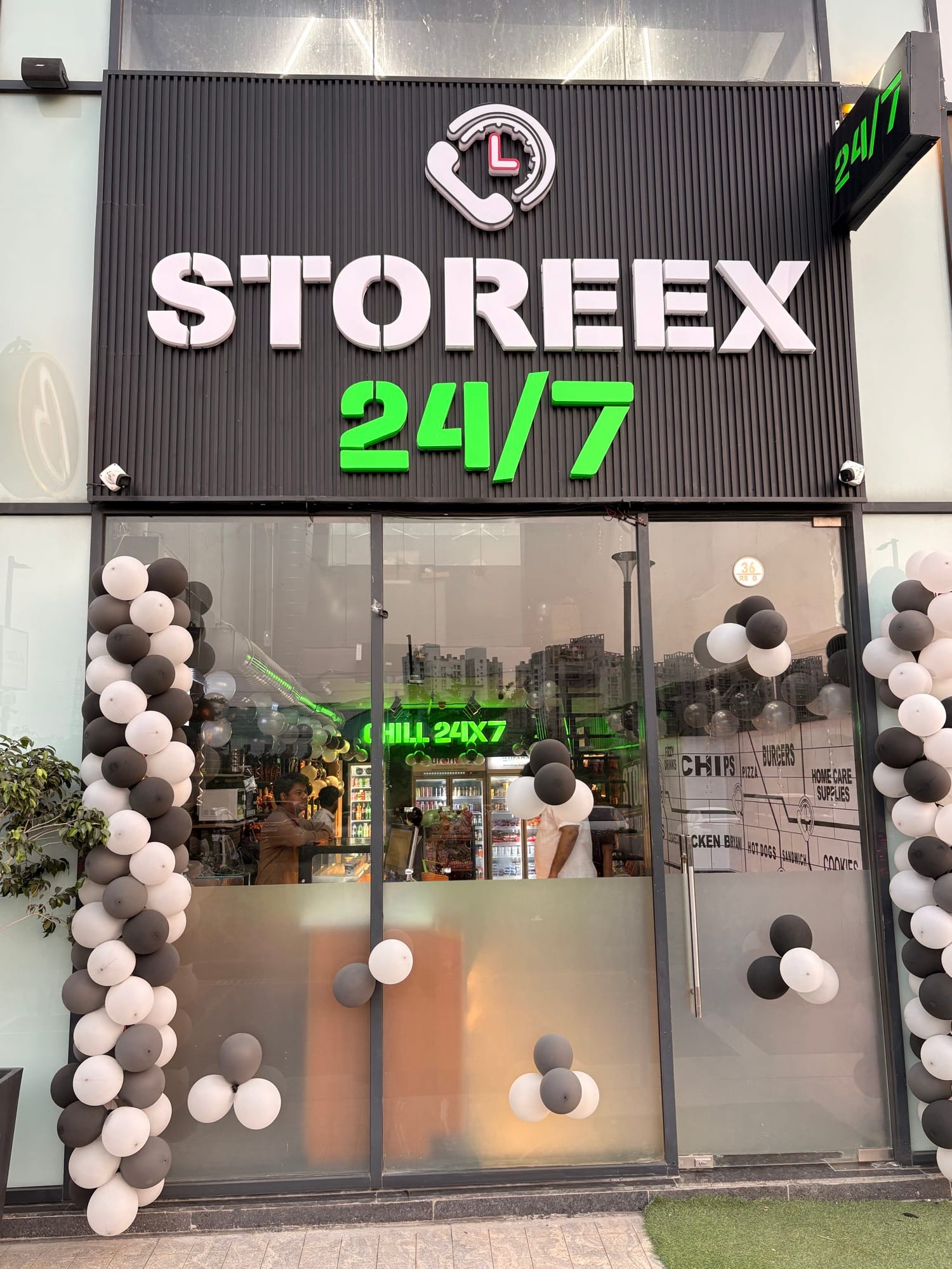 Storeex 24/7 storefront entrance with signage